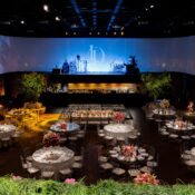 Corporate event stage setup with LED screen and lighting